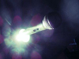 This photo is by a participant of the winter 2014 PhotoVoice class. It says, “Even in the darkness, the mic will still stand.”