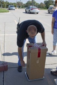 A Buffalo County Sherriff's offcer secures a box of collected medication.