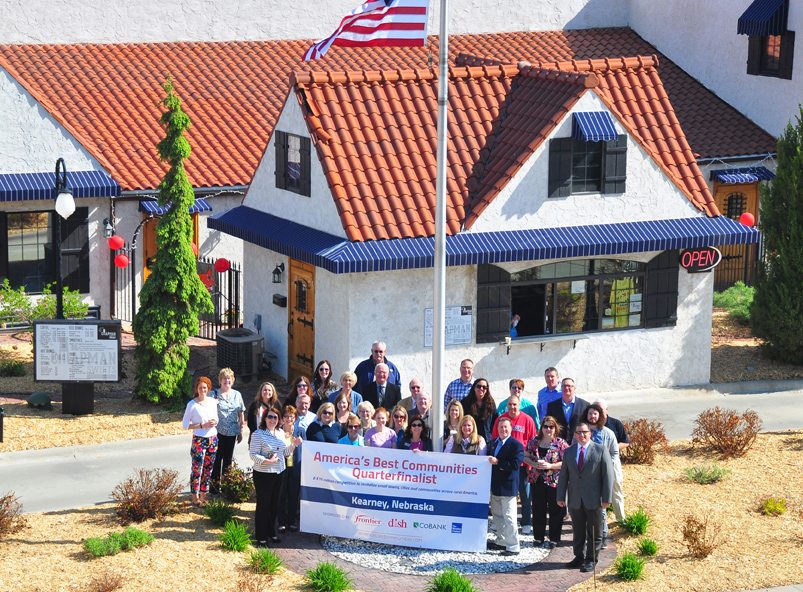 Community members met with the planning team to learn about the next steps of the competition and show off Kearney's victory banner.