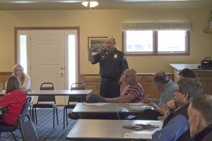 Kearney Police Chief Dan Lynch discusses after-Cruise Nite activities with local landlords, property owners, and citizens.